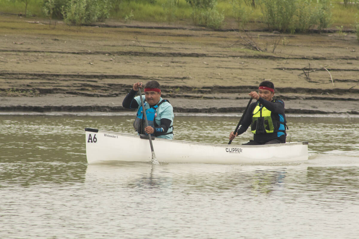 Donovan Arey and JoJo Arey work their paddles down the river. Eric Bowling/NNSL photo