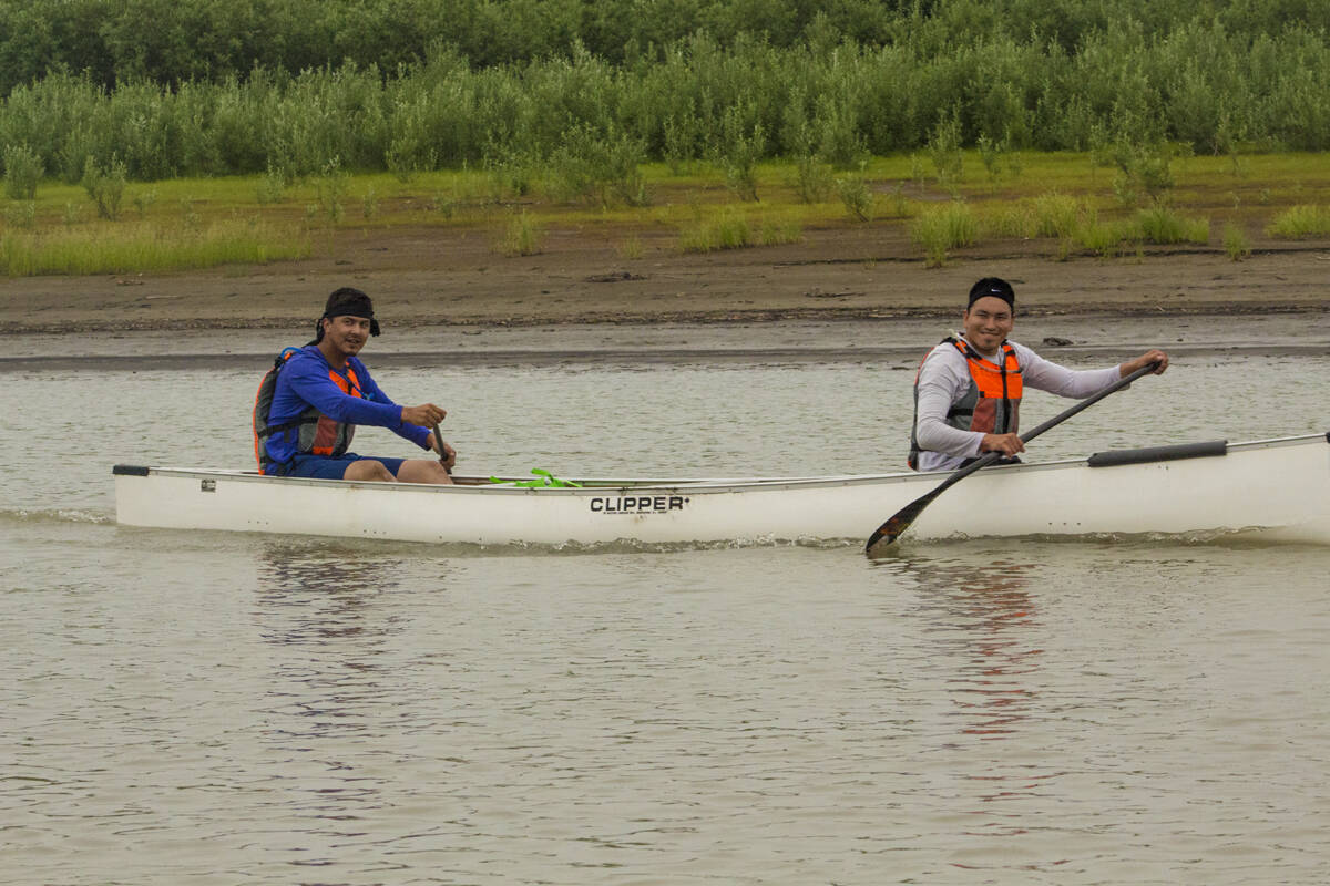 Brandon Johnston and Steven Mooney smile for the camera as the support boat passes them by. Eric Bowling/NNSL photo