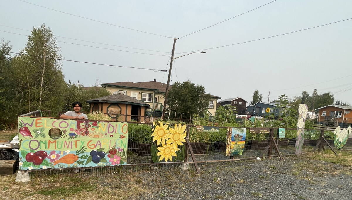 Joseph Vital Abel stops by the Ndilo community garden to water plants. Photo courtesy of Roy Erasmus