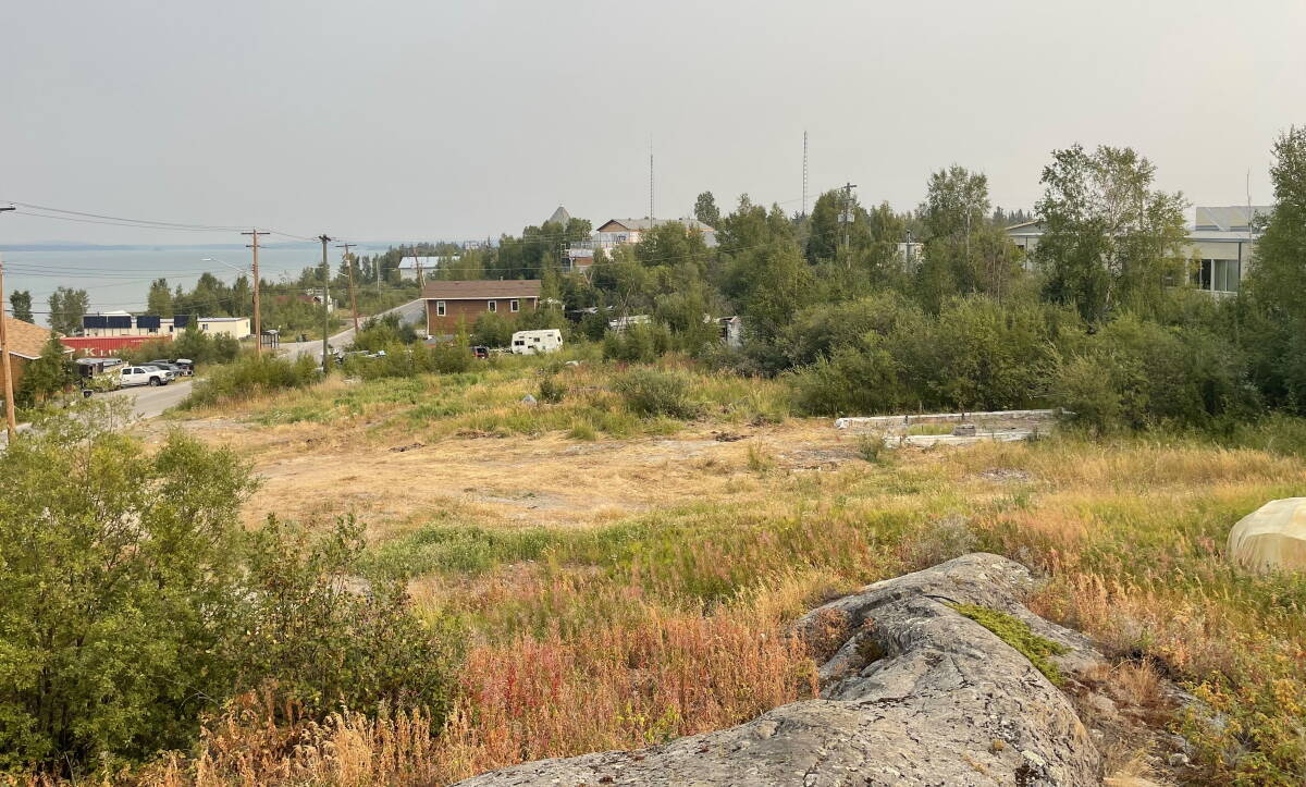 A view of Ndilo with Kalemi Dene School on the right. All of Ndilo has trees like this and community members are afraid of fires in the summer if the unlimited access to water is discontinued. Photo courtesy of Roy Erasmus