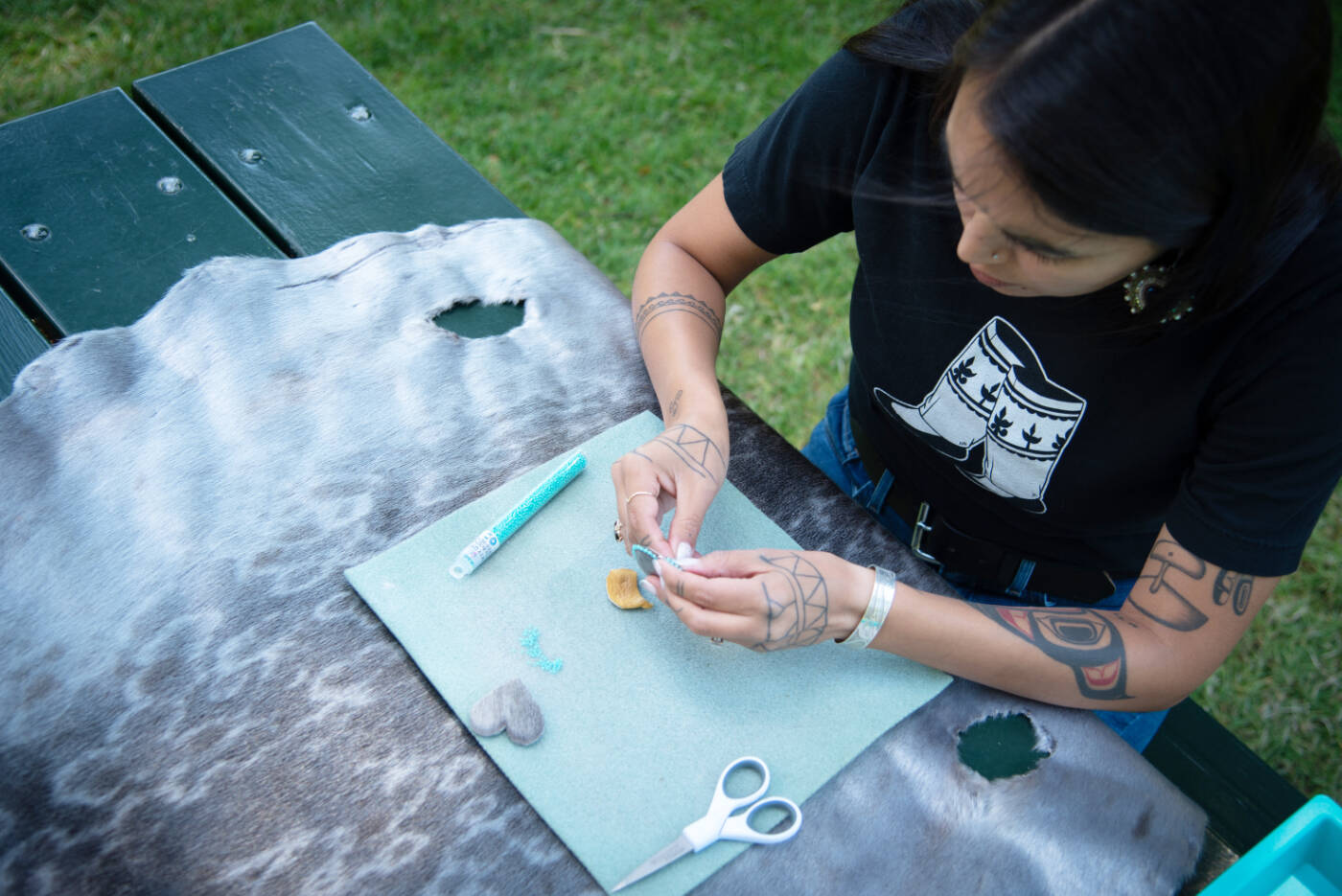 Katie Manomie works on a beading project. Photo courtesy of Nicole Crescenzi