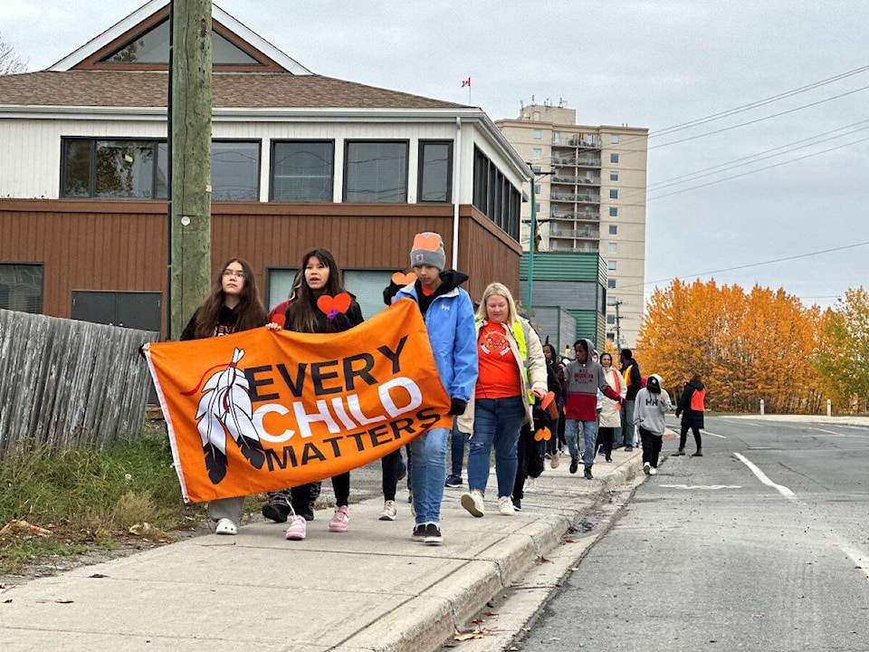 34068918_web1_231004-YEL-Orange-March-Weledeh-Walk_3