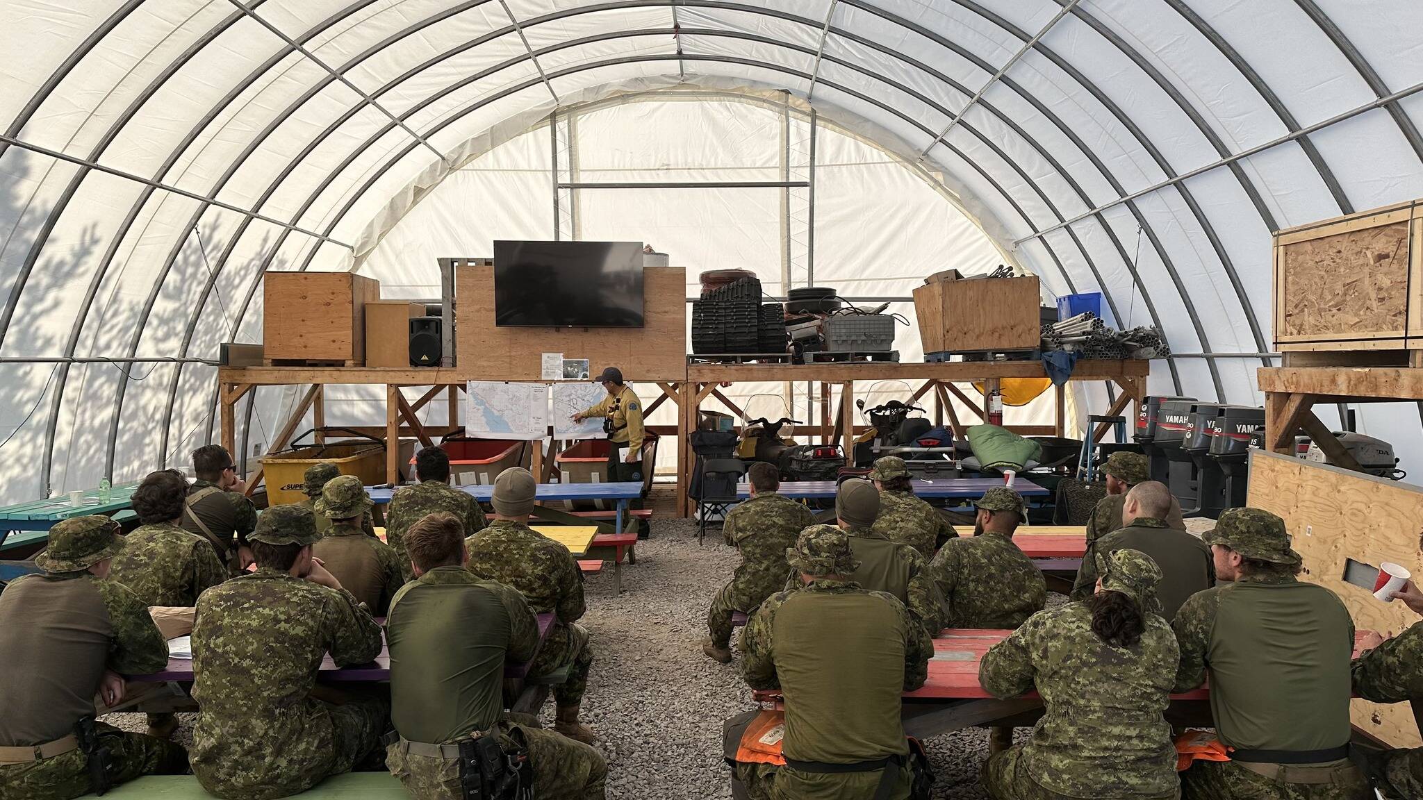 Canadian Armed Forces personnel get a briefing on what they were dealing with in the massive Behchoko-Yellowknife fire on Aug. 21. Photo courtesy of GNWT