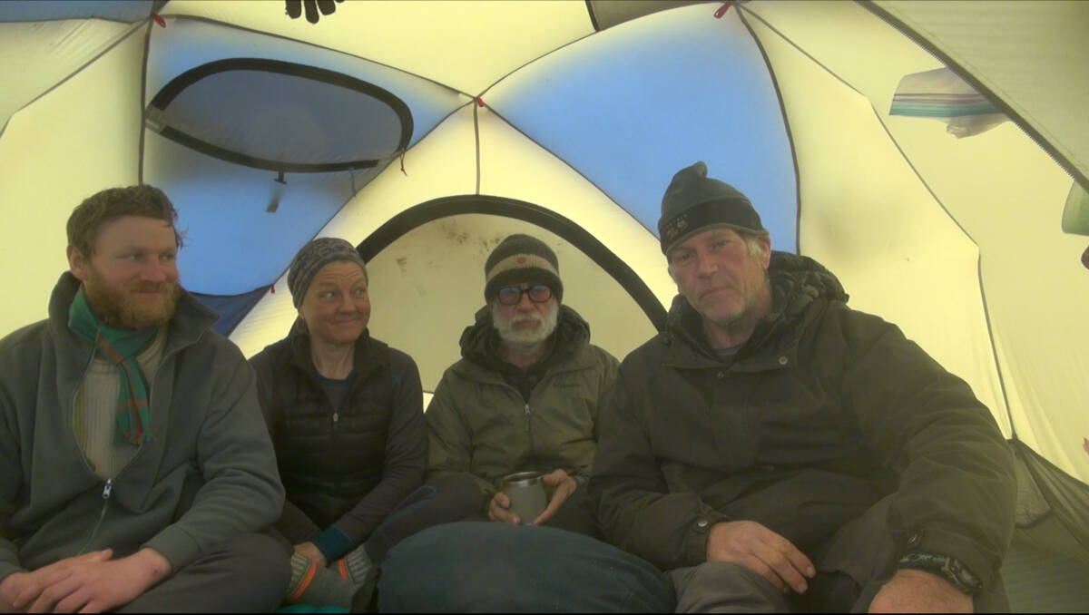  Mark Agnew, Eileen Visser Jeff Wueste, and West Hansen sit in a tent after hitting the shoreline upon completing their journey in this video where they thank their supporters. Screenshot courtesy West Hansen 