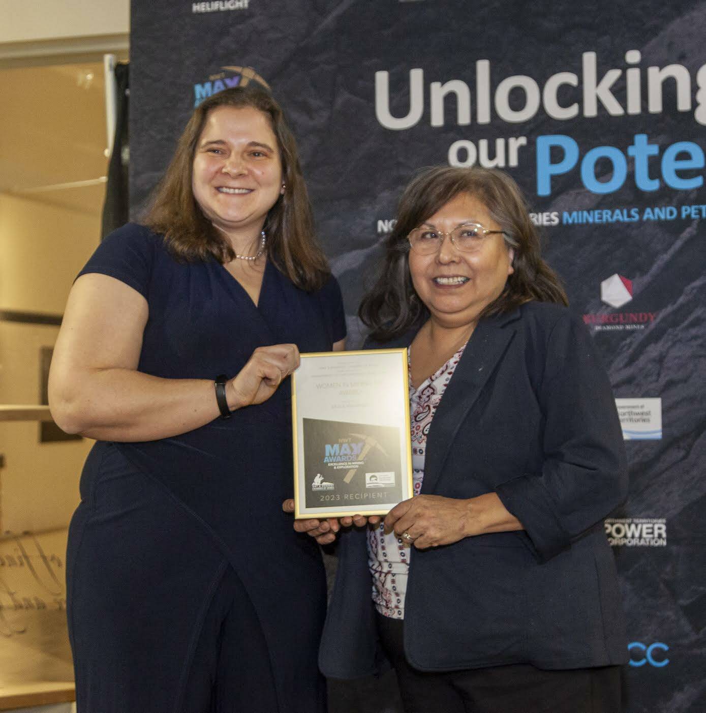 From left, geologist Melissa Ng presents the 2023 Women in Mining NWT award to Grace Mackenzie at the MAX Awards banquet in Yellowknife. Photo courtesy of Bill Braden Photography