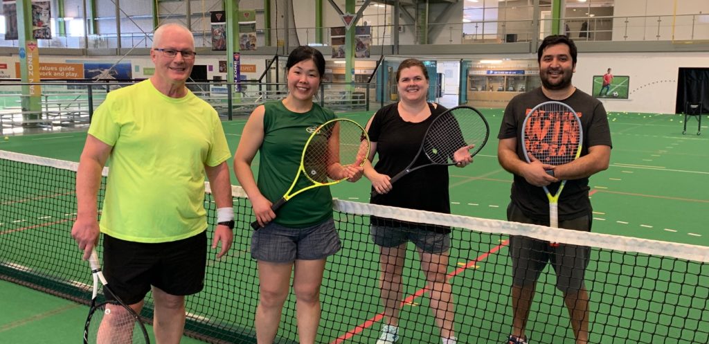 Randy Rivers, left, Hiro Kobayashi, Elizabeth du Plessis and KM Safat Rashif were the finalists in the  Tennis NWT March Tournament's men's singles division at the Fieldhouse on Sunday evening. Rivers and Kobayashi teamed up to win in straight sets. photo courtesy of Slavica Jovic