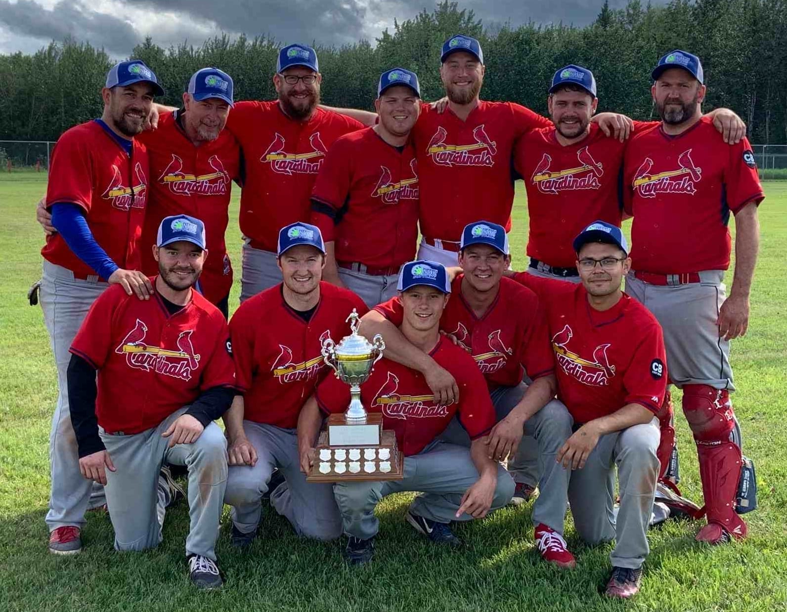 The Home Building Centre Cardinals are your 2019 NWT Men's Fastpitch Championship winners after defeating the Fire Prevention Prospectors in the final in Fort Simpson on July 28. They are, front row from left, Matt Walker, Devin Case, Brady Daniels, Jaden Beck and John White; back row from left, Brian Couvrette, Mike Dove, Mike Auge, Alex Brockman, Devin Hinchey, Garrett Hinchey and Chris Cahoon. photo courtesy of Garrett Hinchey