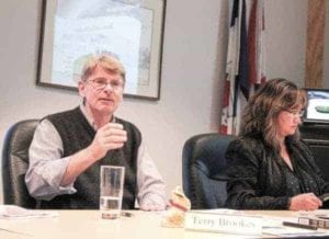Terry Brookes, trustee at Yellowknife Education District No. 1, presents the school board's 2017/18 draft budget on April 27 at the district office in Yellowknife. Pictured at right is Tram Do, director of corporate services. - Kirsten Fenn/NNSL photo