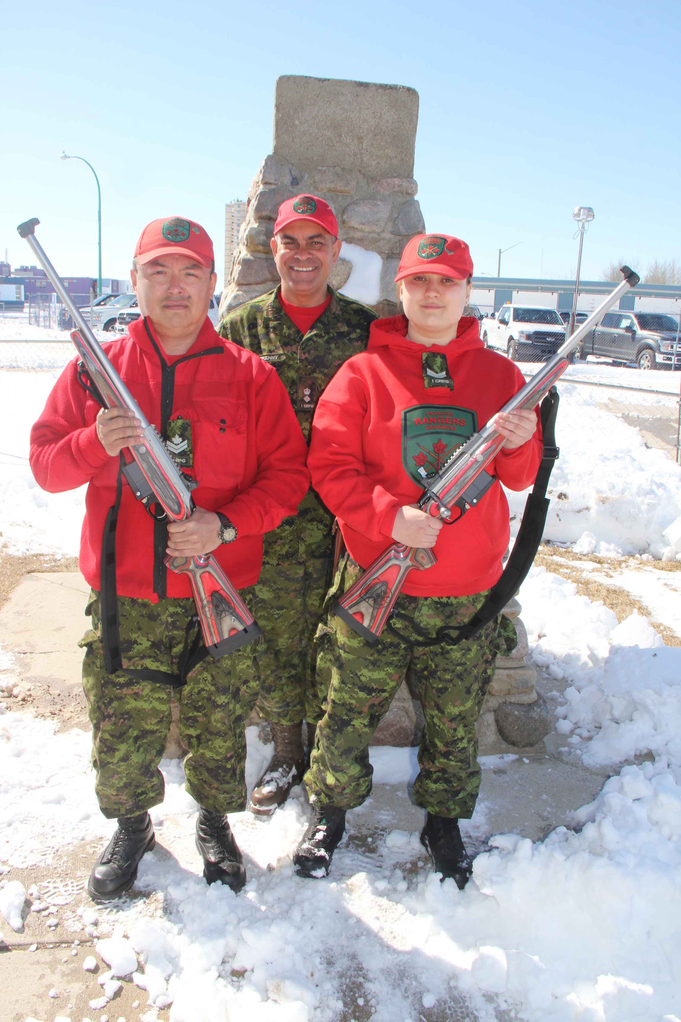 Members of the Hay River Canadian Ranger Patrol,– including Master Corporal Kevin Lafferty, left, and Corporal Kayla Hoff, right, – have received the new C-19 Ranger Rifle to replace the Lee-Enfield Mark 4 Rifle, which Canadian Rangers have used since 1947. In the background is Lieutenant-Colonel Tim Halfkenny of Yellowknife, the commanding officer of the 1st Canadian Ranger Patrol Group. Paul Bickford/NNSL photo