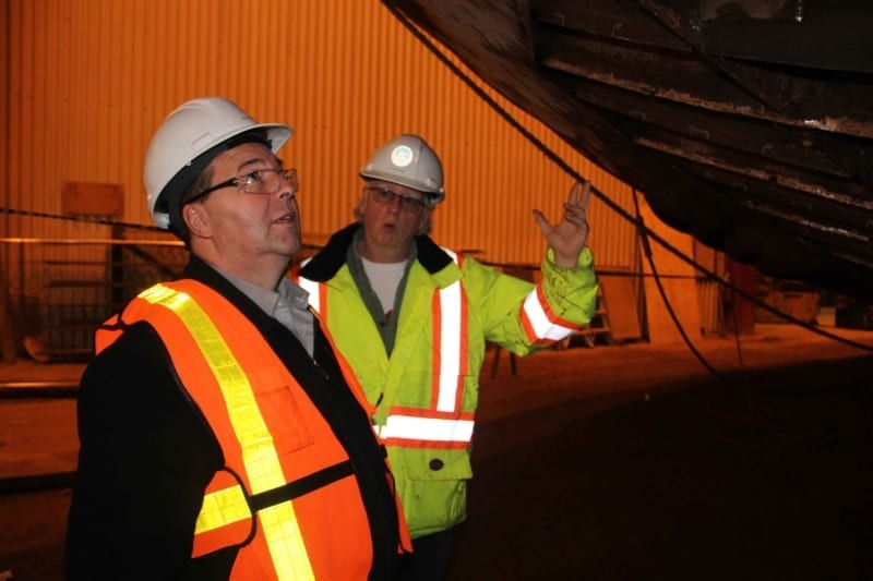 Infrastructure Minister Wally Schumann, left, and Pat Williams, the assistant director of marine maintenance with Marine Transportation Services (MTS), inspect work on the tugboat Jock McNiven during a tour of the MTS Shipyard in Hay River on March 22. Paul Bickford/NNSL photo