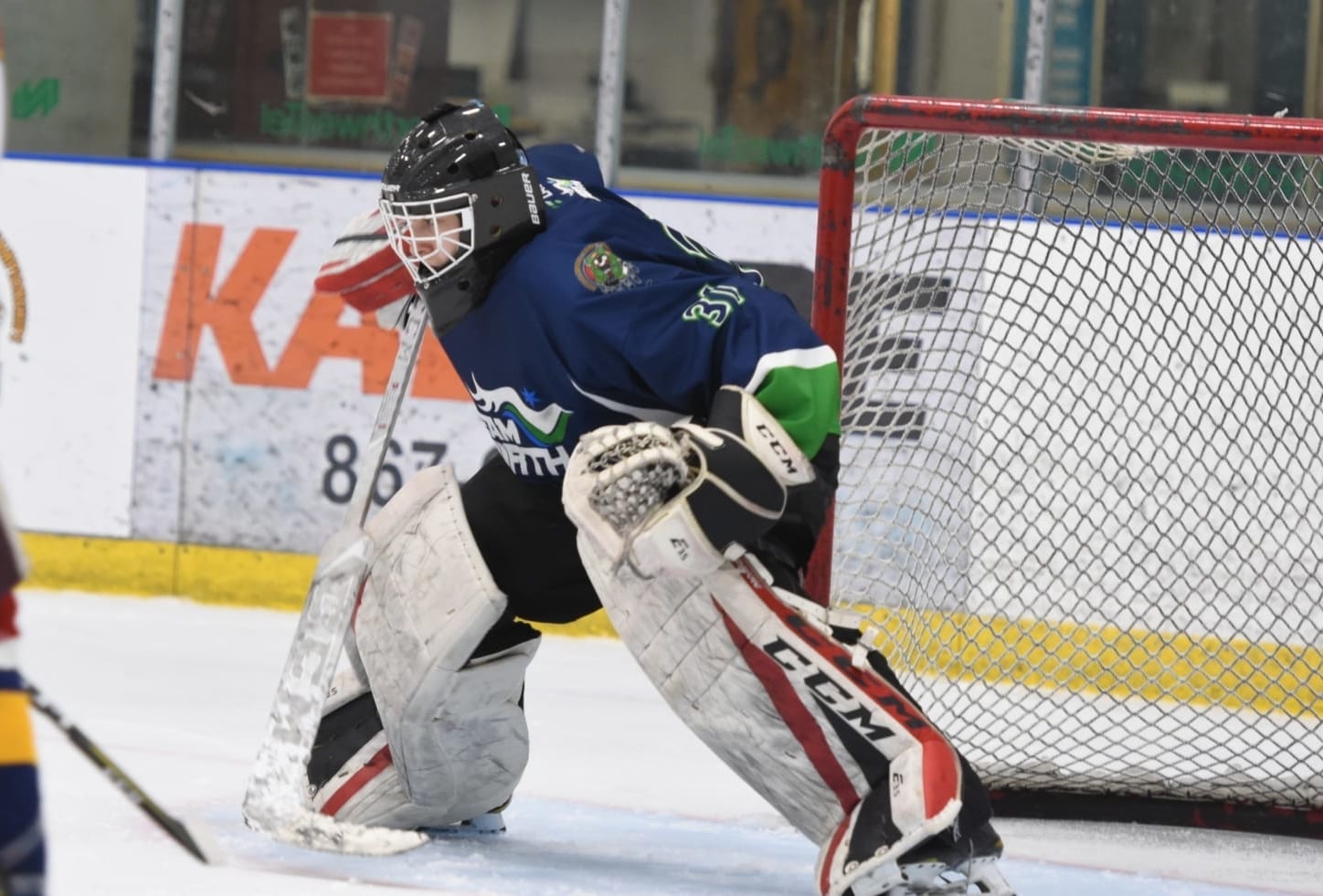 Team North boys goaltender Liam Tereposky gets the poke-check ready during action at the National Aboriginal Hockey Championships in Whitehorse this past May. The future of Team North is up in the air after the Aboriginal Sports Circle of the NWT announced earlier this month that it would no longer foot the bill for the program. Laisa Kilabuk/Aboriginal Sports Circle of the NWT photo