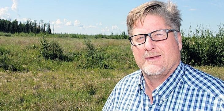 In this photo from August of last year, Mayor Brad Mapes stands on the land targeted for development just south of the Hay River Regional Health Centre. ºÚÁϳԹÏÍø file photo.