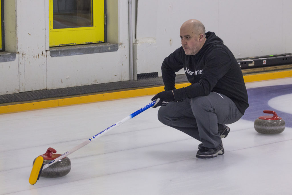 Jamie Koe of Team Koe keeps his eye on the prize during a Saturday morning showdown March 6. Team Koe edged Team Robertson to take the win and claim the NWT Curling Mixed Championship.