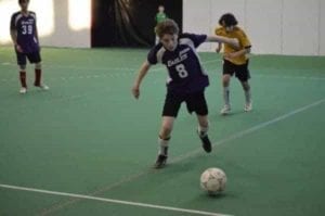 Sam Skinner races down the pitch with the ball during Super Soccer play last weekend in Yellowknife. - James McCarthy/NNSL photo