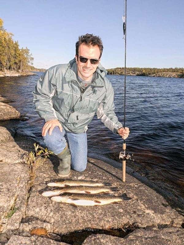 Rohan Brown shows off his limit of northern pike caught during an afternoon of fishing at Grace Lake on Sunday. Grace Lake, although subject to recent residential development around its shore, remains one of the cleaner lakes within Yellowknife city limits. Mike Bryant/NNSL photo