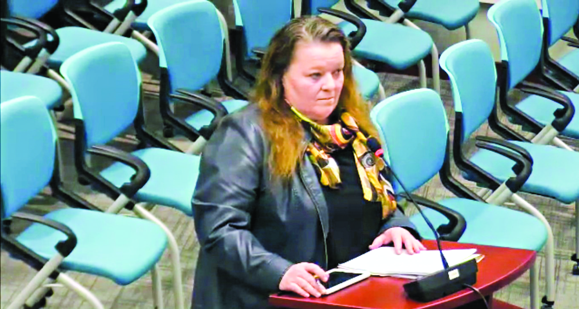 Meda Shanahan stands before city council on March 11 to ask for special permission to use electronic soft meters, as to avoid installing city mandated mechanical fare meters so their new cab company can open on time. Photo courtesy of the City of Yellowknife