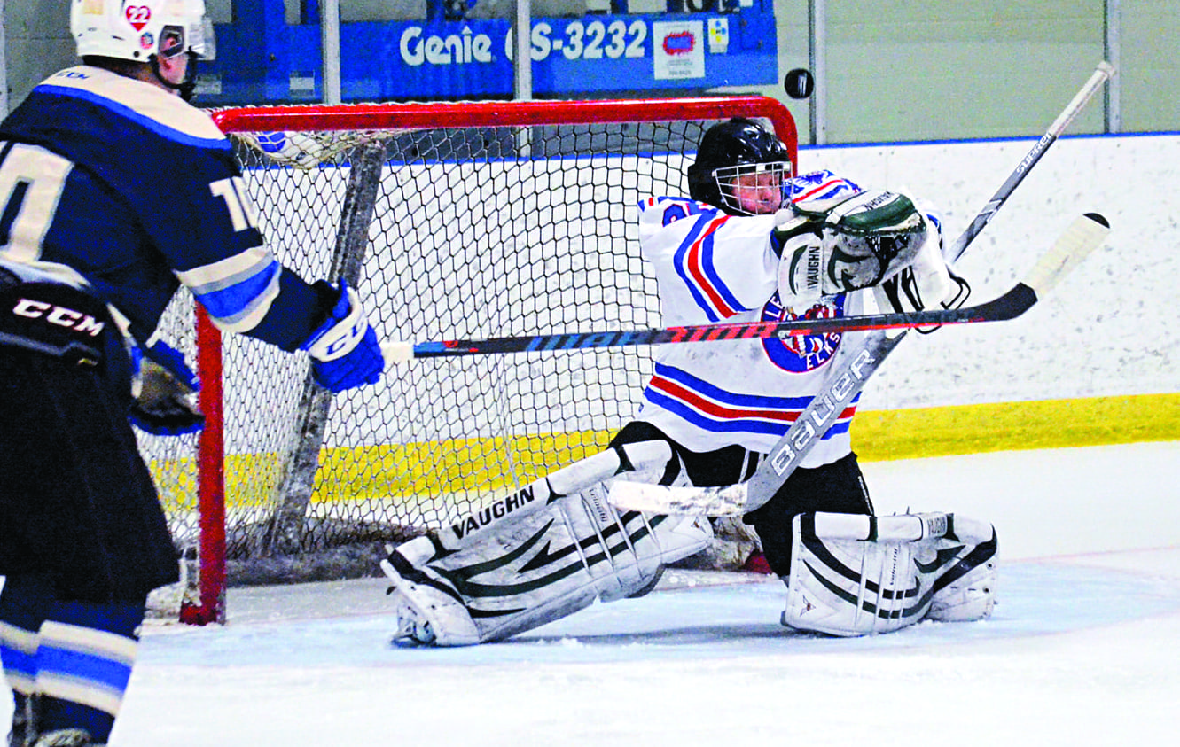 Tehnille Gard stops a point shot for the Ollerhead Elks during B division action in the Canadian North Rec Hockey Tournament at the Multiplex in April 2019. Gard played in that tournament, as well as the Canadian North Balsillie Cup the weekend prior, and missed playing in both this year. NNSL file photo