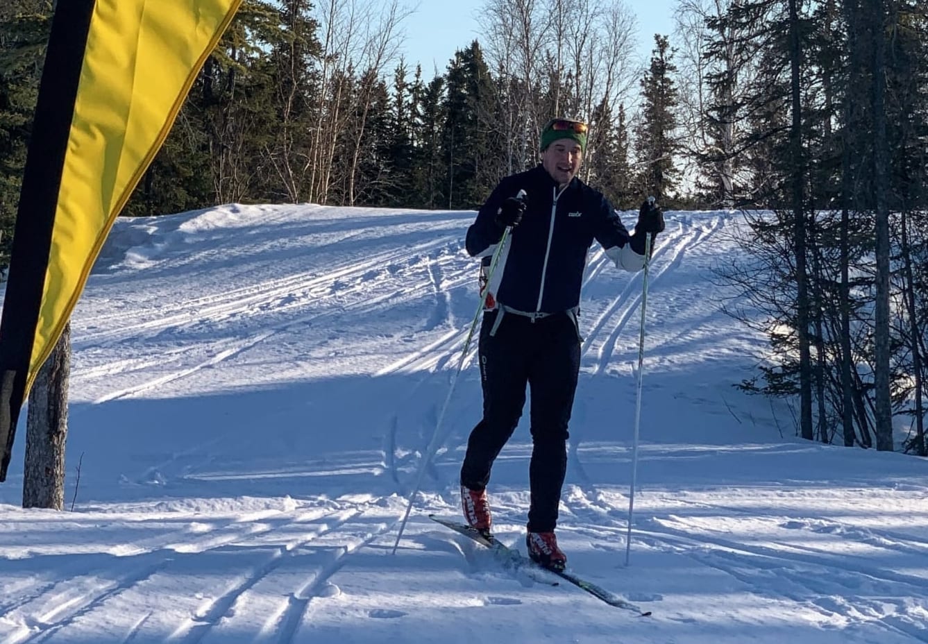Mike Argue skis past the Yellowknife Gold Loppet flag at the Yellowknife Ski Club during the club's Great COVID-19 Non-Loppet on April 5. photo courtesy of Damian Panayi
