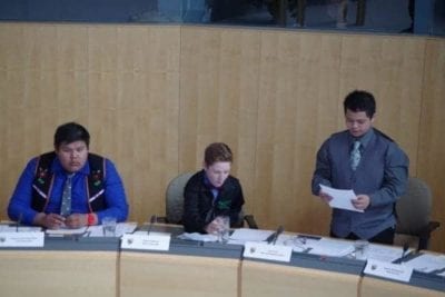 Angus James Capot-Blanc, left, representing Nahendeh and Robert Paddock representing Frame Lake listen as Ivan Ceria, representing Yellowknife Centre, speaks about the problem of homelessness on the streets Yellowknife on Thursday, May 11 at the legislative assembly. Emelie Peacock/NNSL Photo