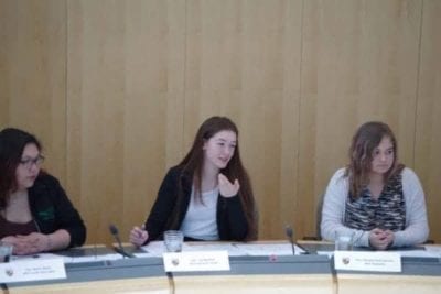 Myha Martin, right, representing Inuvik Twin Lakes, Lisa Boutilier, representing Hay River South, and Macayla Flett-DaCorte, representing Thebacha, during a sitting in the Youth Parliament at the Government of the Northwest Territories legislative assembly on May 11. Boutilier responded to a motion to regulate marijuana across the territory, which passed with 14 votes for, three against and one abstention. Emelie Peacock/NNSL Photo