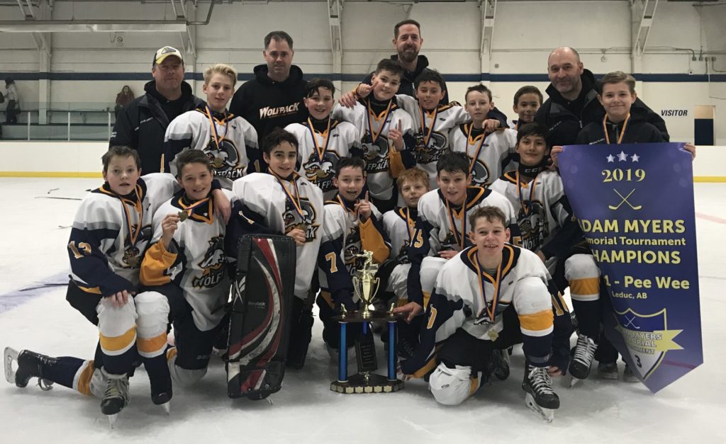 The Yellowknife Wolfpack peewee boys took top spot at the Adam Myers Memorial Tournament in Leduc, Alta., in December 2019. They are, in front, Ryder Wicks; middle row from left, Evan Power, Blake Rose, Vincent Hottin, Tucker Beck, Corwin Simmons, Callum MacLean, Ryder Wicks, Wesley Lizotte, Matthew MacKay, back row from left, assistant coach Shaun Murray, Nolan Dusome, assistant coach Lee Scarfe, Peter Staples, Ryan Clark, assistant coach Andrew MacKay, Rylan Scarfe, Hayden Murray, Blake Remo and head coach Darren Wicks. A lot of these players haven't played a lot of games this season but at least they'll have a big send-off this weekend with as many as 60 people in the stands in each rink at the Multiplex. photo courtesy of Darren Wicks