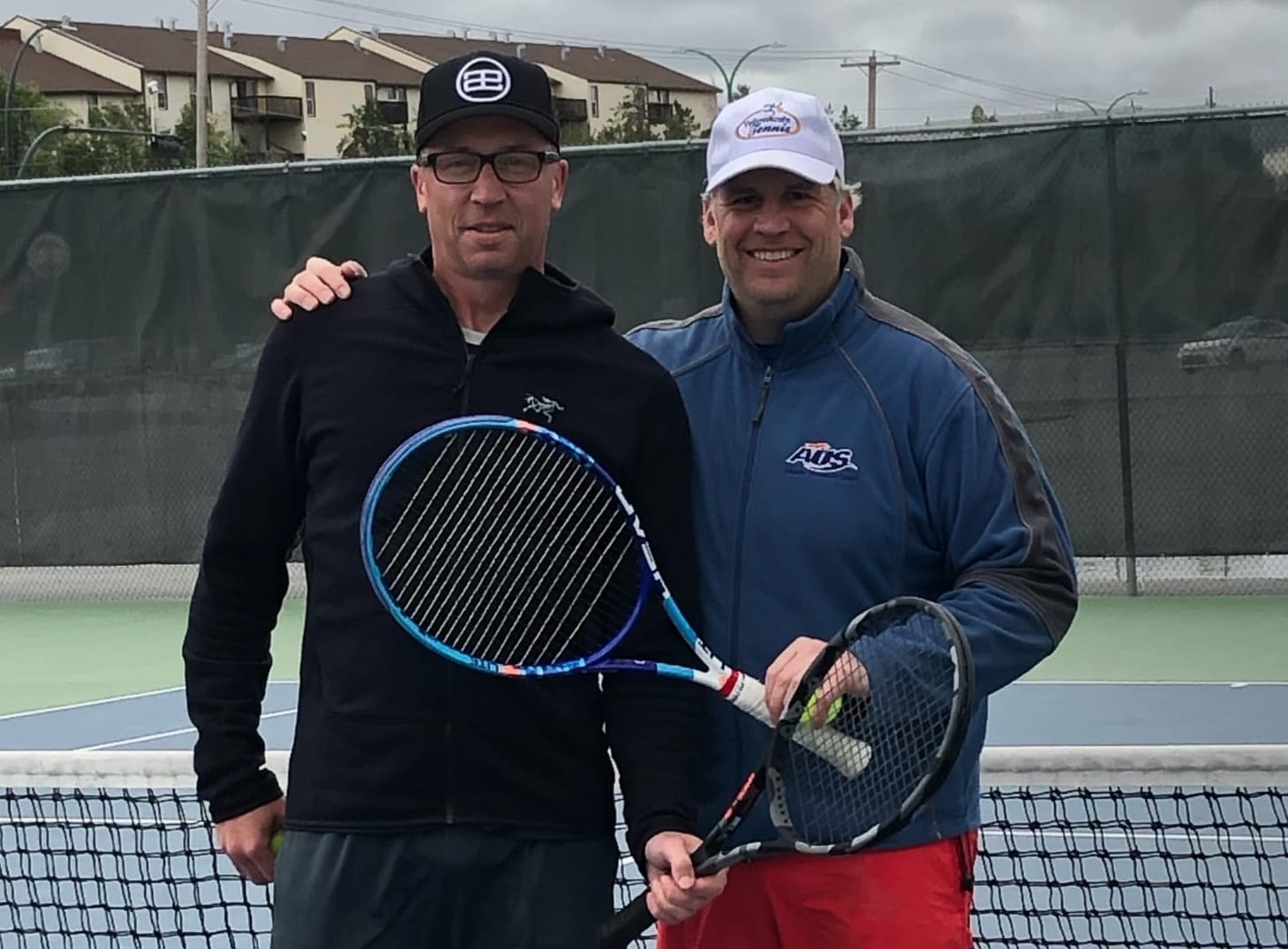 Brooke Harker, left, and Alex Godfrey were the men's singles finalists in the Yk Tennis Open at the Yellowknife Tennis Club earlier this month. Godfrey won that battle but they teamed up to win the men's doubles later in the tournament. photo courtesy of Tami Johnson