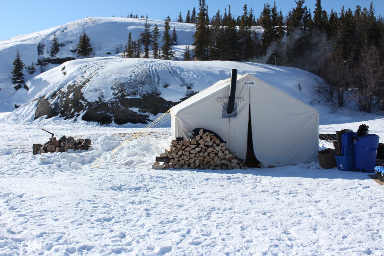 The Rainbow Coalition fish camp takes place on the eastern side of Jolliffe Island in a wood stove heated prospectors tent. Participants help set nets under the ice on Great Slave. Brett McGarry / NNSL Photo
