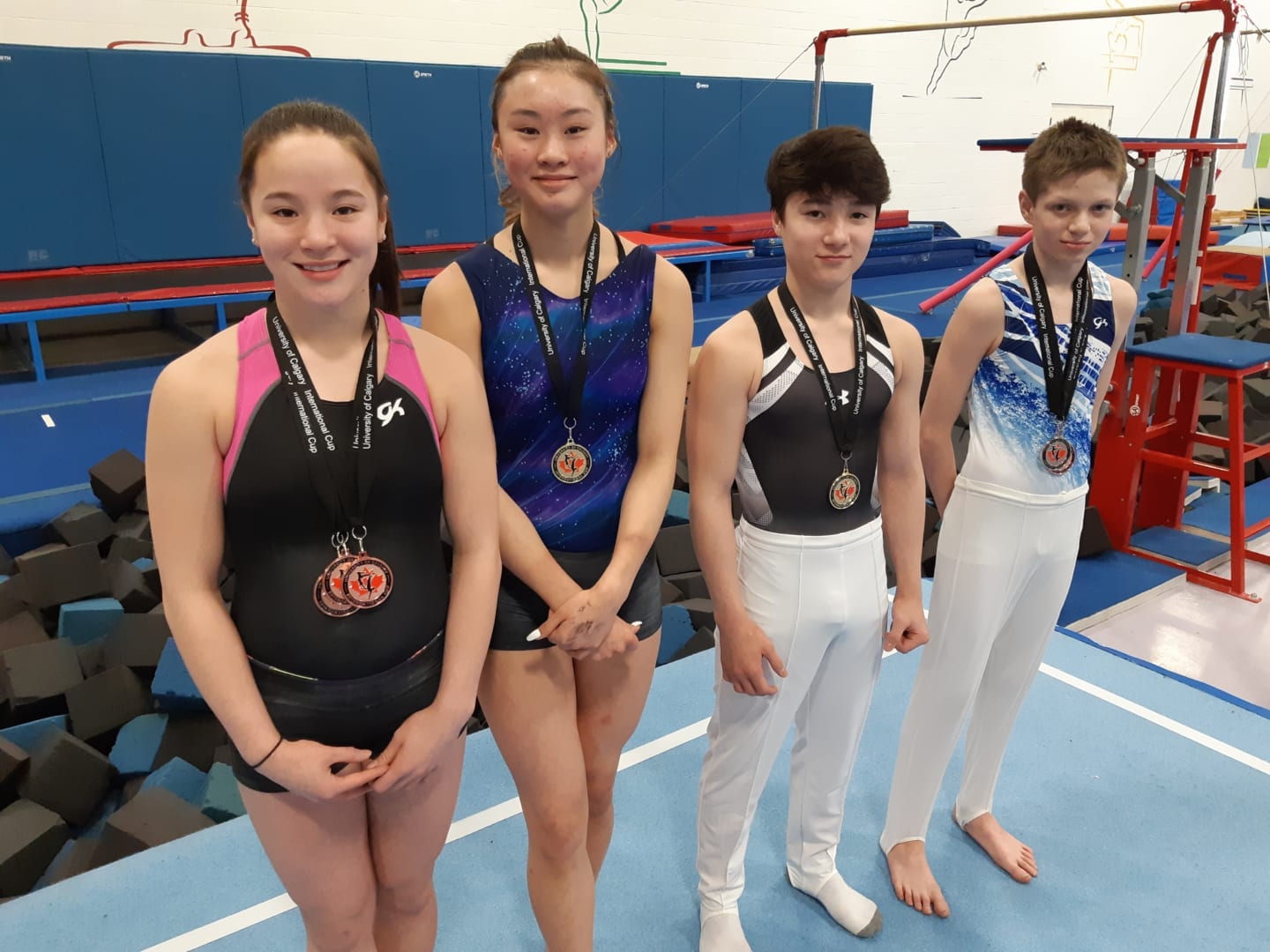 Four members of the Yellowknife Gymnastics Club came home from the University of Calgary International Cup competition last weekend with some new neckware. They are, from left, Emma Leathem, Jade Ko, Ty Leathem and Noel Barrichello. James McCarthy/NNSL photo