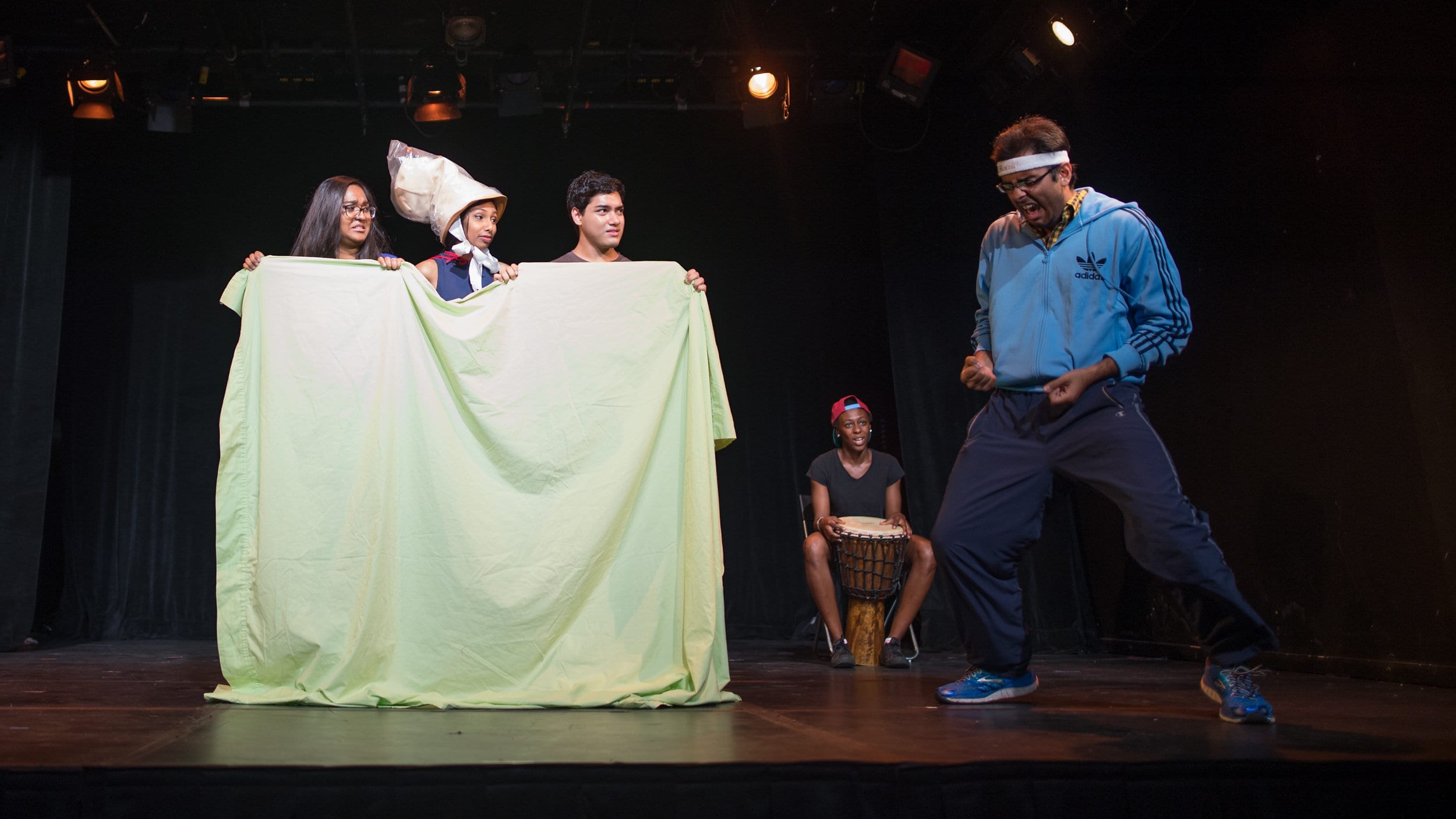 Sara Ahmed, left, Niru Jeya, Aleef Khan and Michelle Nyamekye of SExT perform a scene called “Captain Condom” in their play about sexual education targeting youth. photo courtesy of Dahlia Katz