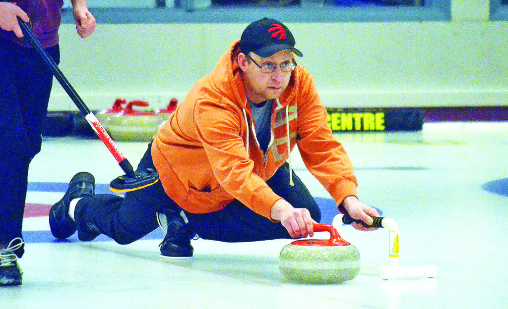 Inuvik's Mark Robertson delivers one of his skip stones during action at the NWT Men's Curling Club Championship in Yellowknife on March 21. James McCarthy/NNSL photo 