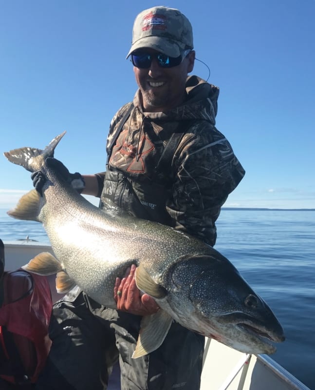 Ryan Gregory hold a 42 pound pike he helped an 85 year old guest catch while was out guiding for Plummer's Lodge on Great Bear Lake. He said he hopes to be able to get out and catch a fish that size one day and beat his own personal record. Courtesy of Ryan Gregory