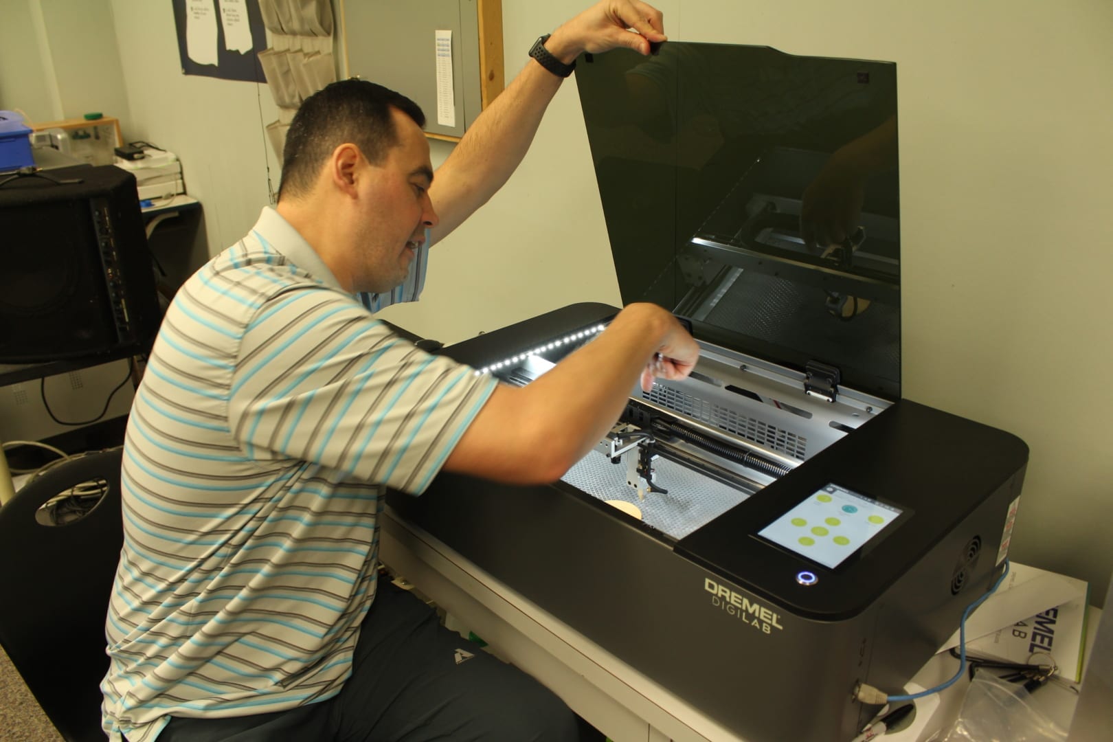 Brett McGarry/ NNSL Photo Assistant Principal Derryl Mitchener at Range Lake North School shows off the schools latest addition to their tech room, a laser cutter.