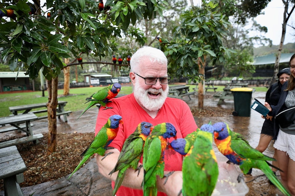Ian Legaree enjoys some time with the birds during a trip to Australia. Photo courtesy of Alexander Legaree
