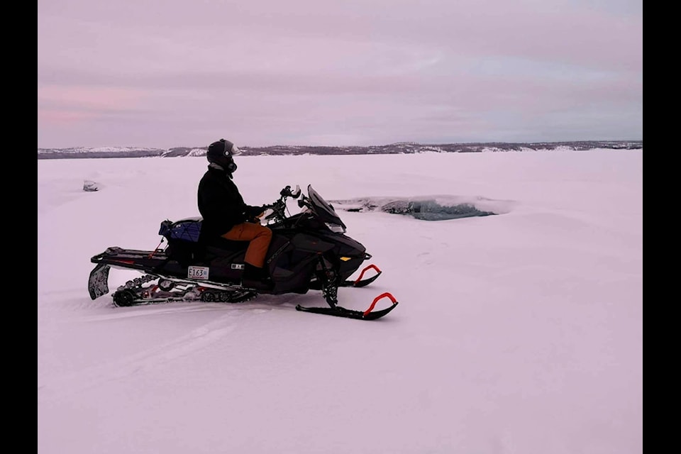 A volunteer with the Great Slave Snowmobile Association checks on a pressure ridge while out on a ride in January 2023. Photo courtesy of Great Slave Snowmobile Association