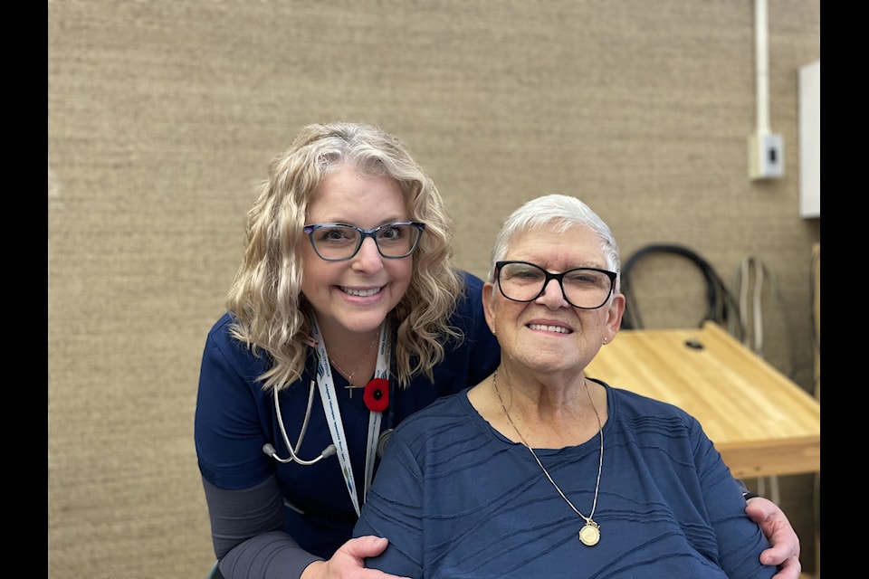 Janie Neudorf, left, and Gisela Snyder pose at the Baker Centre during the first pop-up flu vaccine clinic in the city on Thursday.