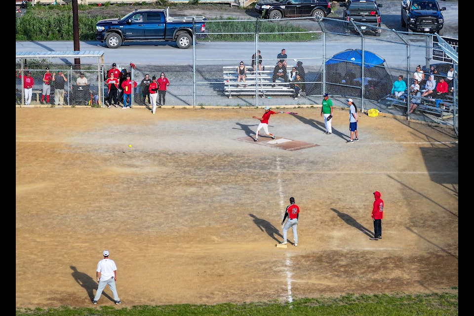 A batter knocks a grounder past first base.