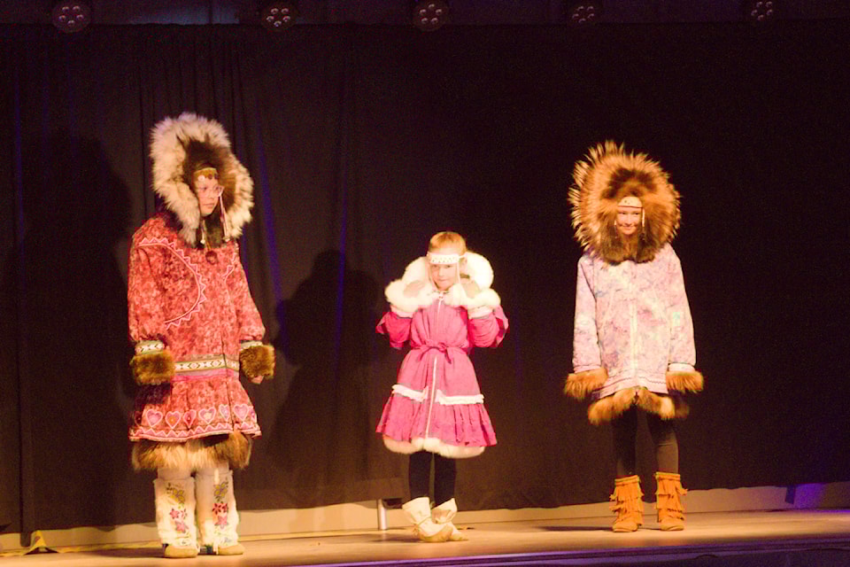 Leni McDonald, Svea Johnson and Mila Johnshow wear traditional starburst style parkas.