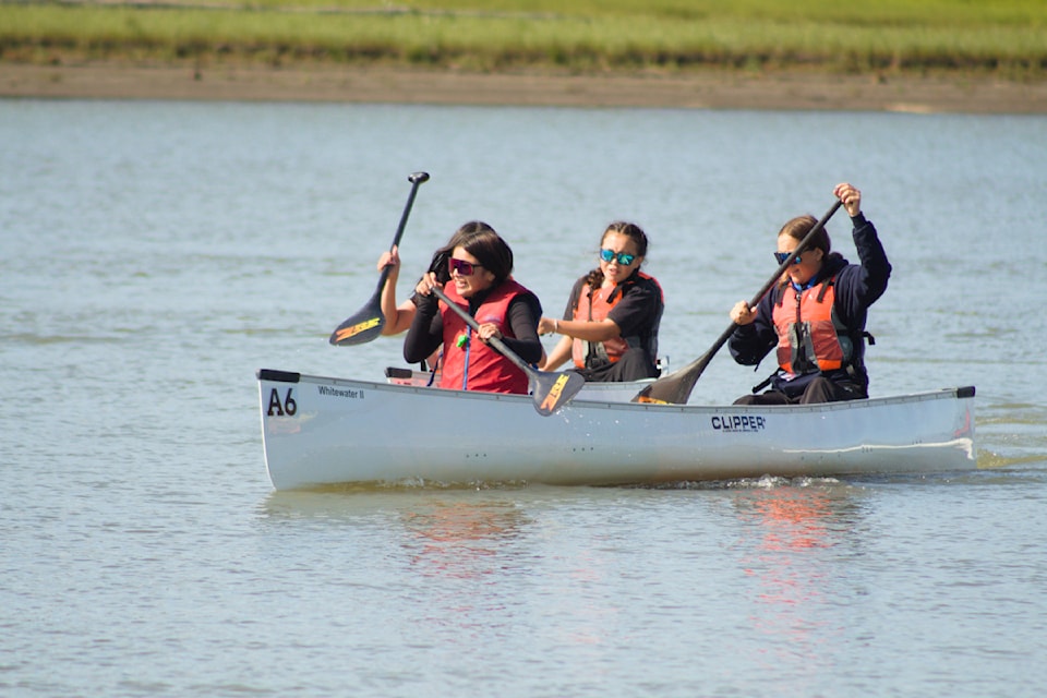 Rose and Brooke Lennie-Blake jockey for position with Ally Blake and Emery McLeod during the junior girls canoe race.