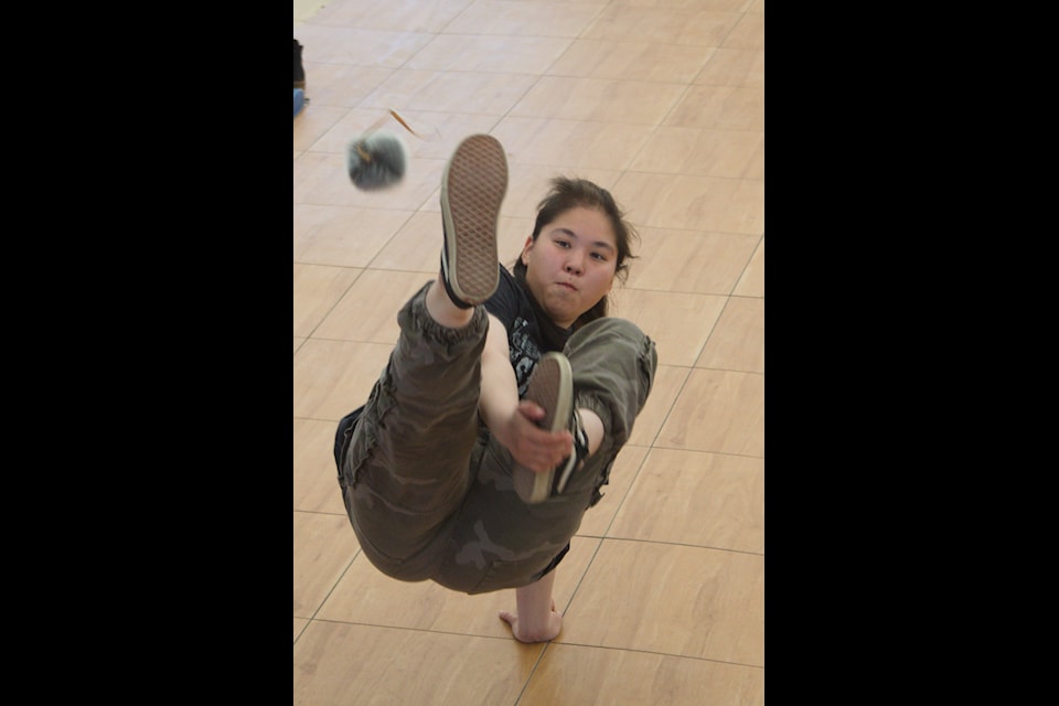 Bailey Nogasak of Inuvik takes to the air during the Alaskan High Kick competition during the 55th ϳԹ Games summit, which took place July 22 to 27 in Inuvik. Athletes from across the territory and beyond were in town to test their skill at traditional games and to celebrate ϳԹ culture.