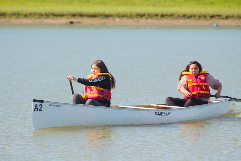 Our Youths of the Week are Heidi Blake and Jessa Greenland, seen here making their way to the finish line to win the Junior Girls canoe races during the Northern Games Summit this summer. Inuvik hosted athletes of all ages in a wide variety of sports throughout the week.