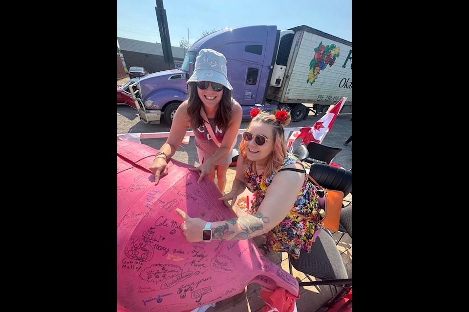 Bailey Corrigal, left, and Shayla O'Connor point out their signatures from the year 2000. Photo courtesy Shayla O'Connor