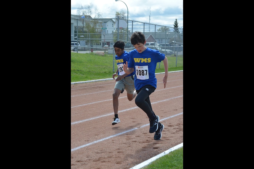 The William McDonald duo of Nikhilesh Gohil, left, and and Alexander Fast come down the stretch during the bantam boys 1,000-metre race.