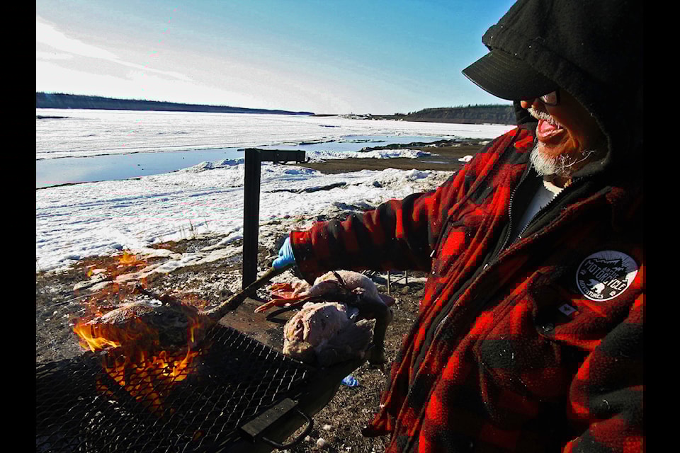 Elder Andy Andre does his burn-and-turn flambé (sans the alcohol) à la Anthony Bourdain.