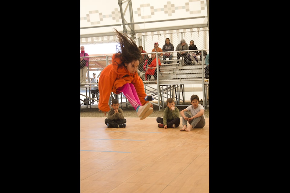 Abigail Voudrach leaps into a two-foot high kick.