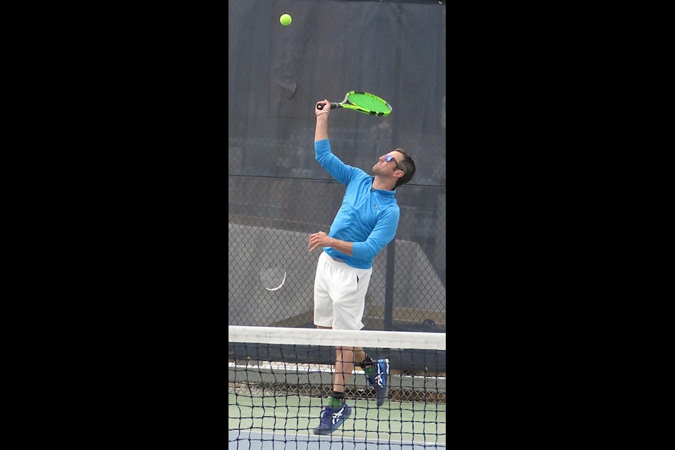 Adrian Treu serves one up during singles action on June 9. Jill Westerman/NNSL photo                