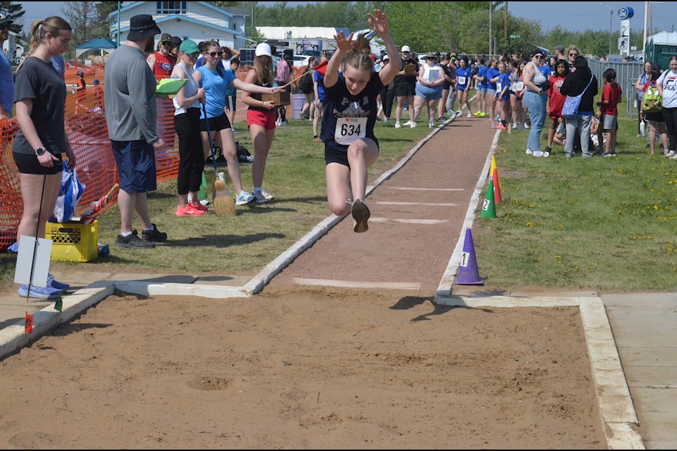 Alice King of Hay River flies through the sir as she prepares to land in triple jump action on June 4. James McCarthy/NNSL photo