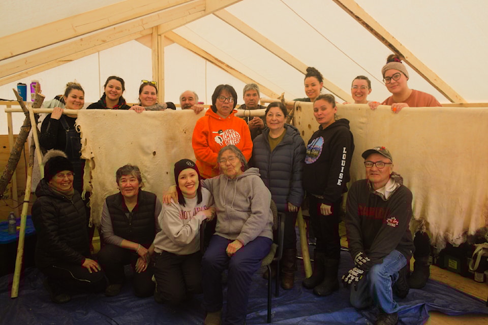 Participants of an 11-day long Moose Hide Culture Camp stop to pose for a photo. Hosted by Inuvik Native Band and Dechinta, the camp taught participants different methods of tanning moose hides from start to finish. Methods were taught by Delaney and Montana Prysnuk of Copper Caribou, Jess Sanderson-Barry of JShine Designs and Brian Rogers of Inuvik. The hides were harvested locally by traditional hunters.