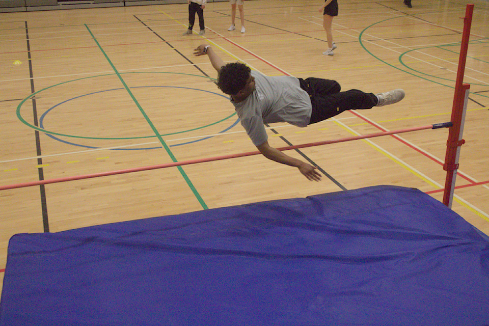 Saleem Suliman clears the bar in high jump.