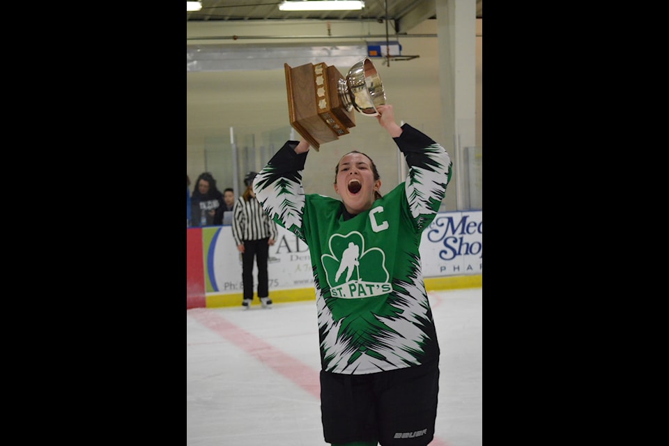 St. Pat's girls captain Sarah Hart hoists the championship trophy above her head after the Irish defeated Sir John Franklin in the 2015 Wade Hamer Challenge Cup girls game. NNSL file photo