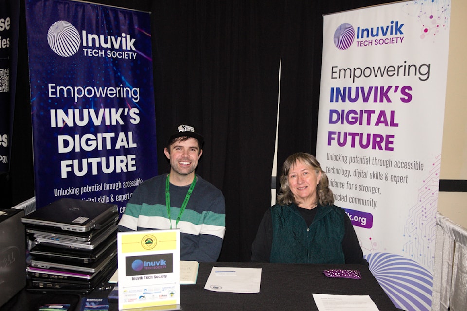 Patrick Gall and Patricia Davison sit at the newly formed Inuvik Tech Society's table.
